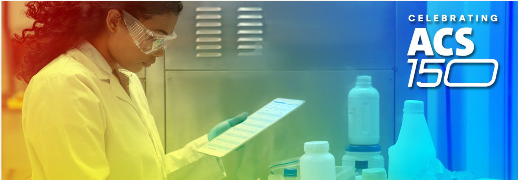 Photo of a researcher looking at data in a laboratory. Celebrating ACS 150