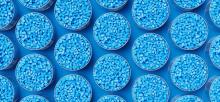 Blue plastic pellets arranged in circles