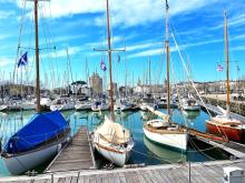 A photo of docked boats under blue sky near La Rochelle, France