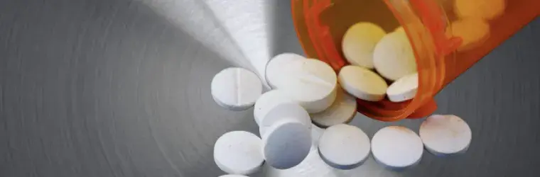 Picture by Canva, steel background w/ pharmaceuticals 