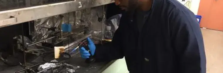 GMSE graduate student Andre Thompson in one of NIST's Fire Research laboratories, testing the flammability of materials  Credit: Susan Heller-Zeisler
